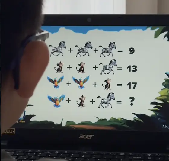A girl counting objects in an online lesson